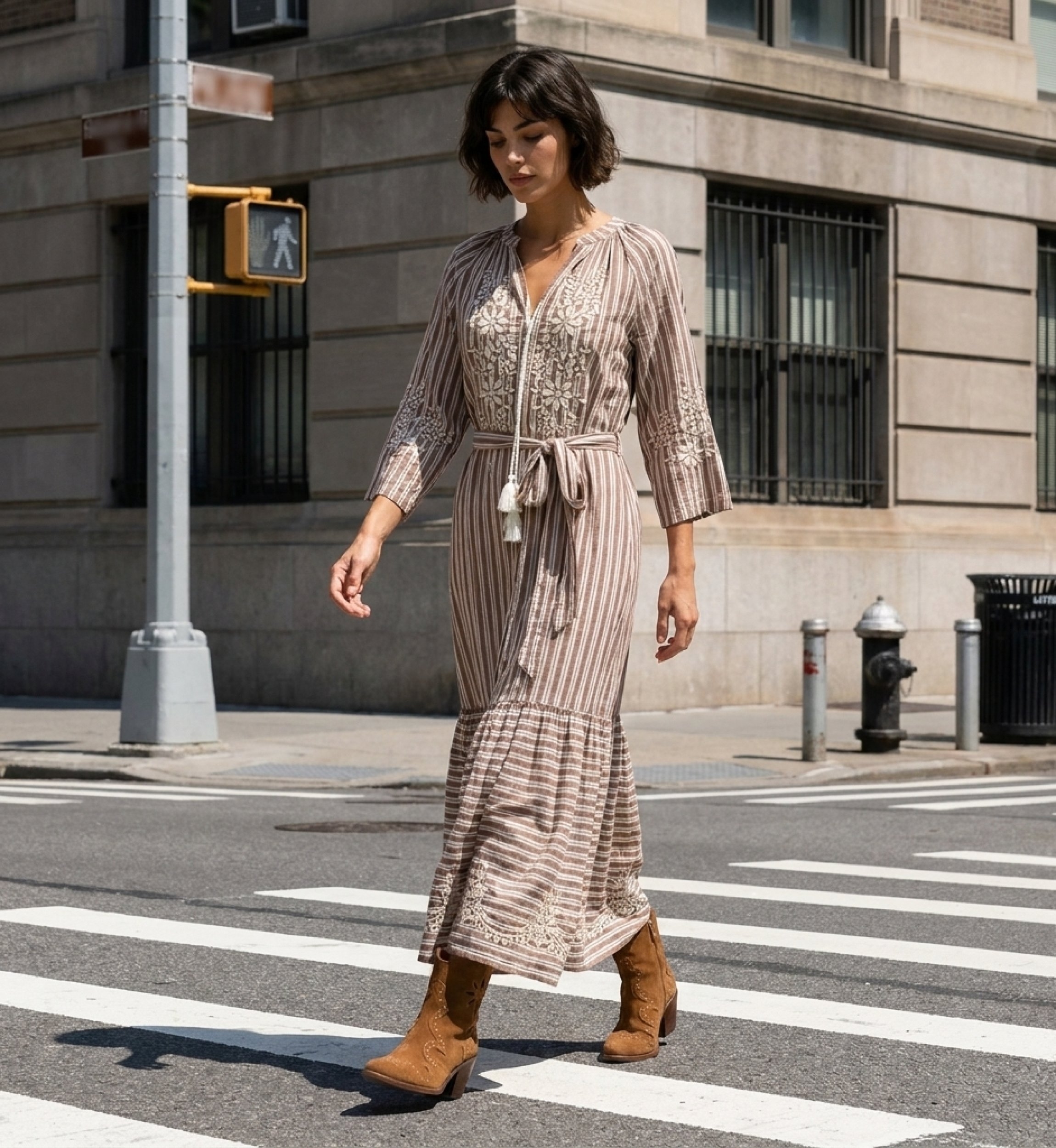 Elegant long maxi dress worn by a model in a vibrant city park setting, perfect for summer events.