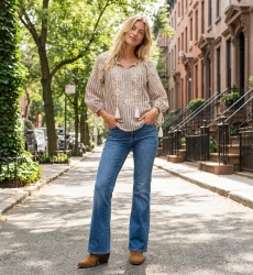 Brown and white striped peasant blouse with v-neck, three-quarter balloon sleeves, white floral embroidery, and tassels.