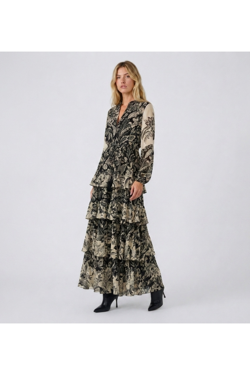 Front view of a long black and beige floral maxi dress with V-neck, long sleeves, elasticated waist, and tiered ruffled skirt in