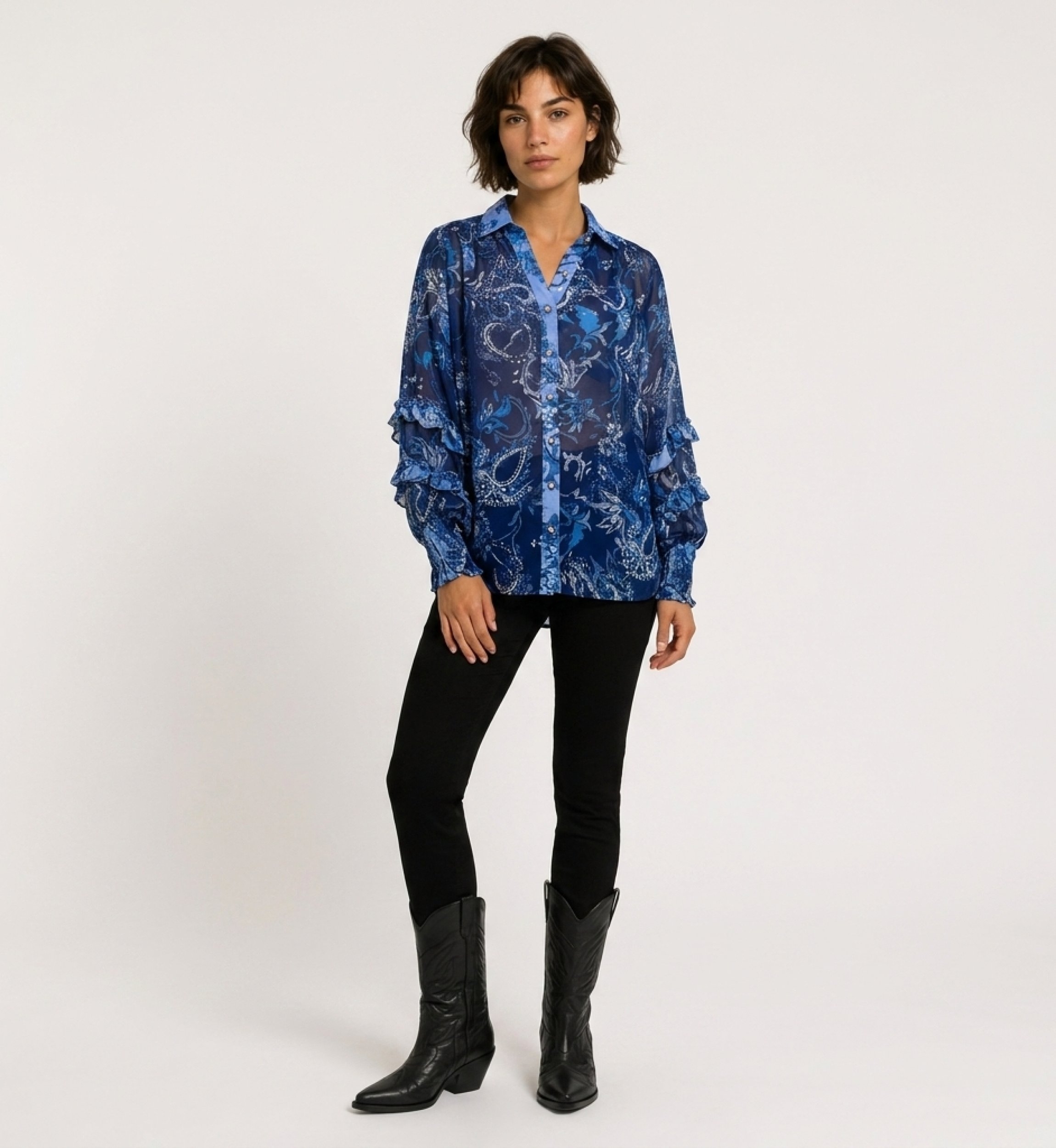 Front view of a blue sheer long-sleeve blouse with paisley and floral pattern, ruffled cuffs, and a collared V-neck.
