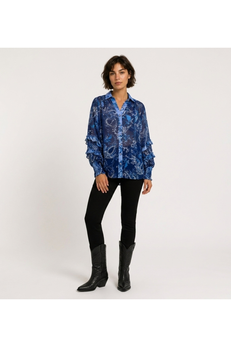 Front view of a blue sheer long-sleeve blouse with paisley and floral pattern, ruffled cuffs, and a collared V-neck.