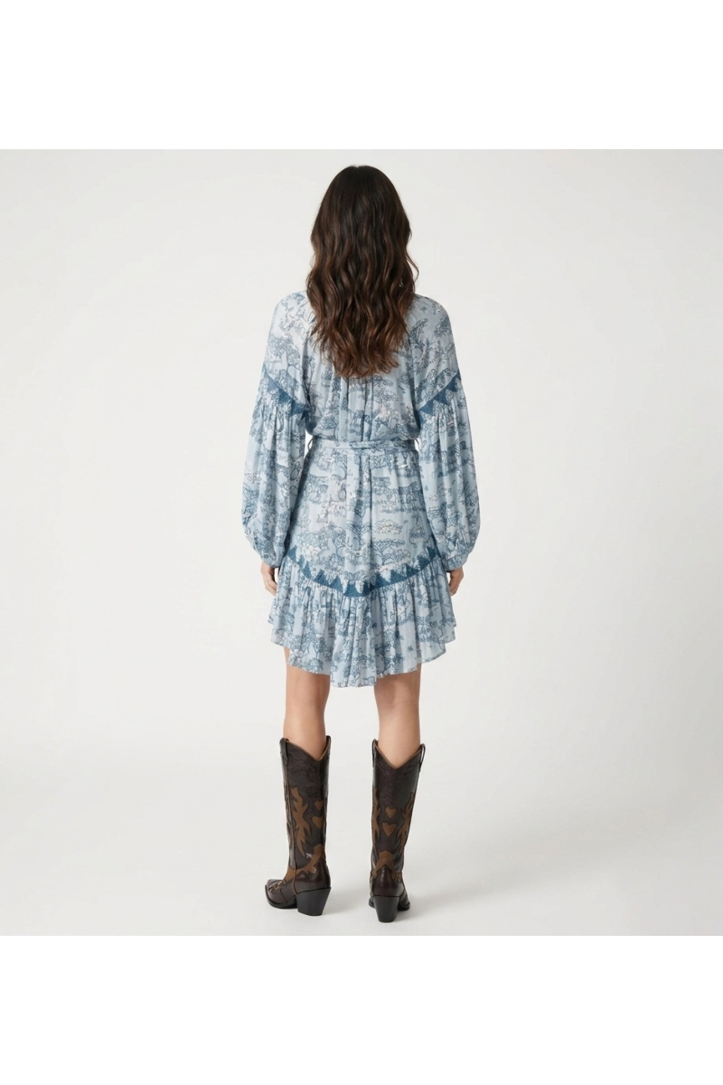 Back view: Women's light blue & teal safari print shirtdress with balloon sleeves, tie waist, ruffled hem.