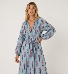 Light blue floral midi dress, three-quarter view. Features long balloon sleeves, V-neck, and tie-waist with tassels.