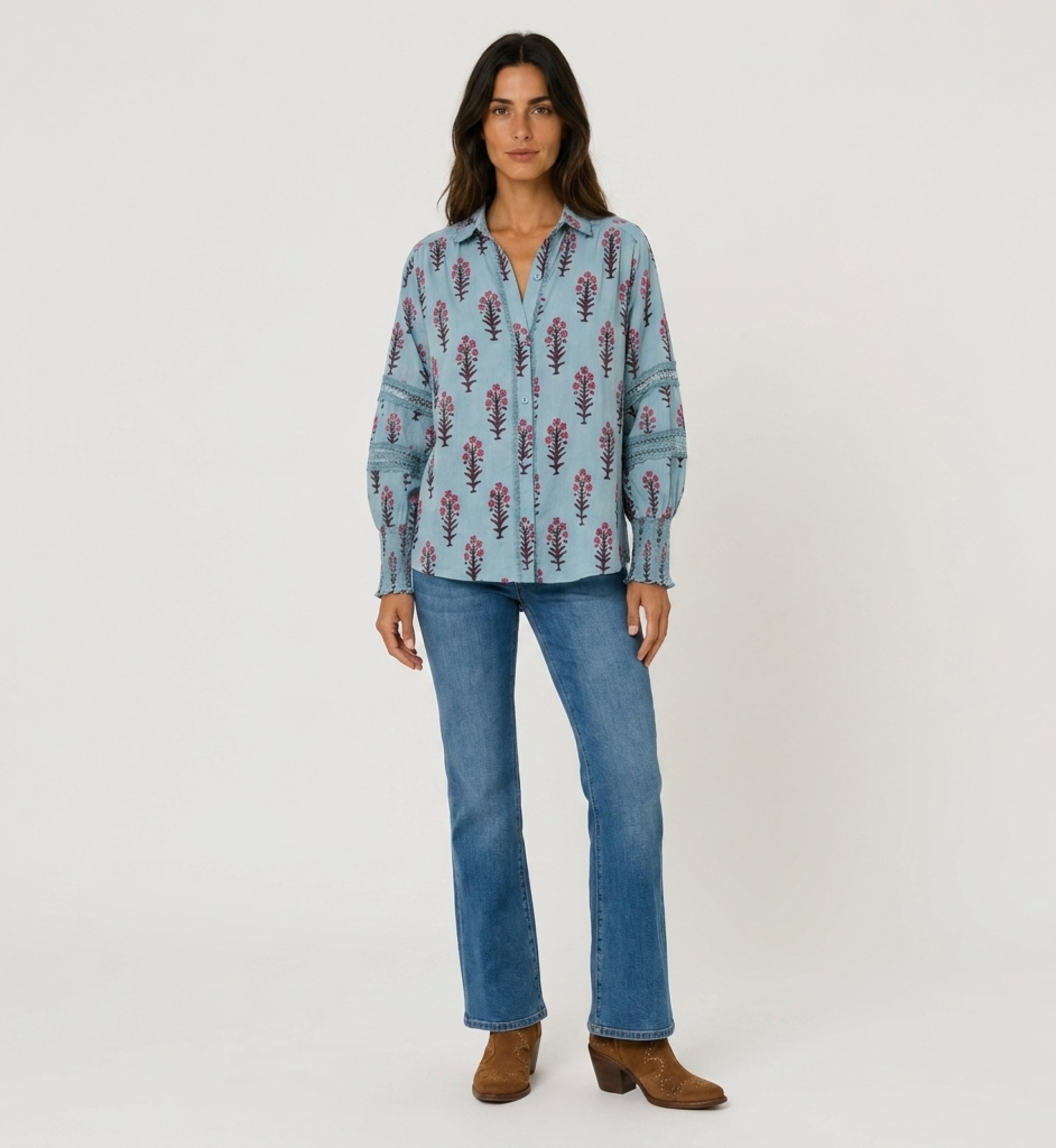 Light blue floral button-up shirt with collared V-neck, balloon sleeves, lace inserts, and shirred cuffs. Front view.