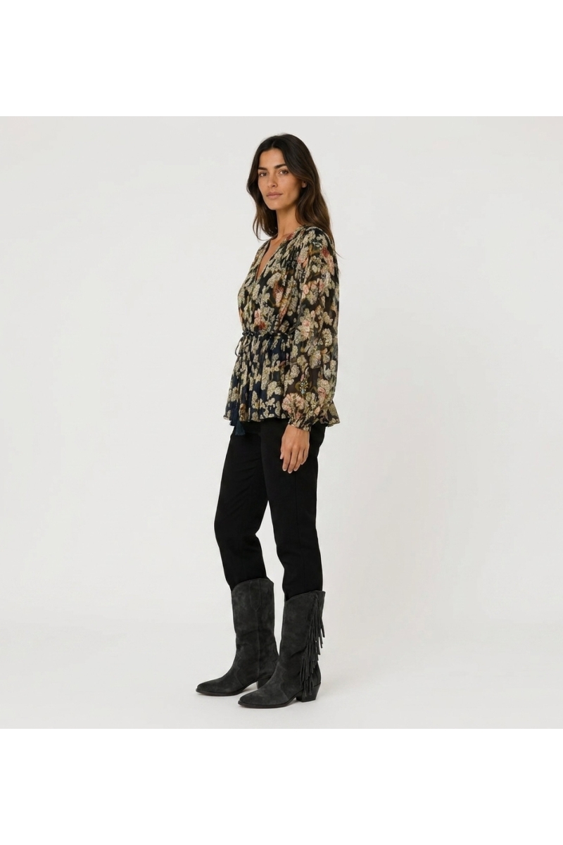 Navy blue long-sleeve V-neck blouse with colorful floral and gold leaf pattern, sheer fabric, and drawstring waist.