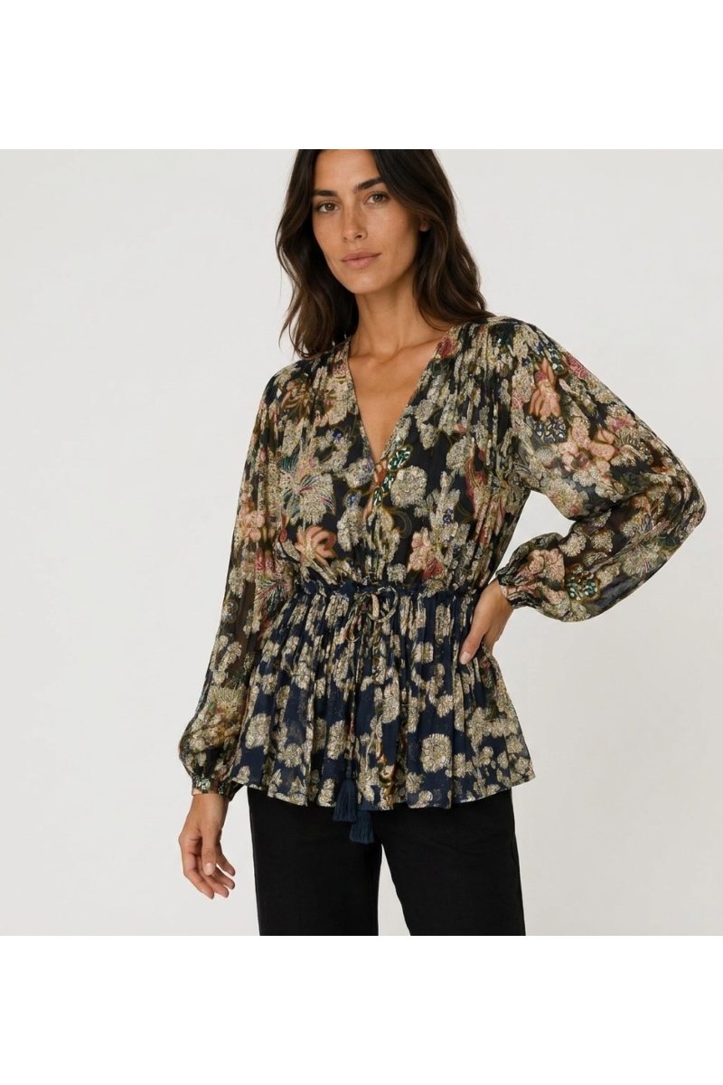 Navy blue sheer long-sleeve blouse with colorful floral and gold leaf pattern, V-neck, and drawstring waist.