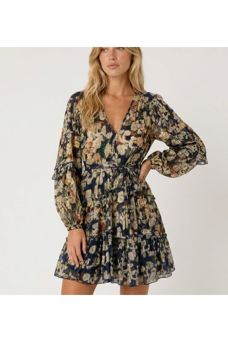 Navy blue short-sleeved V-neck dress with gold floral pattern, tiered skirt, tie waist, sheer fabric, three-quarter view.
