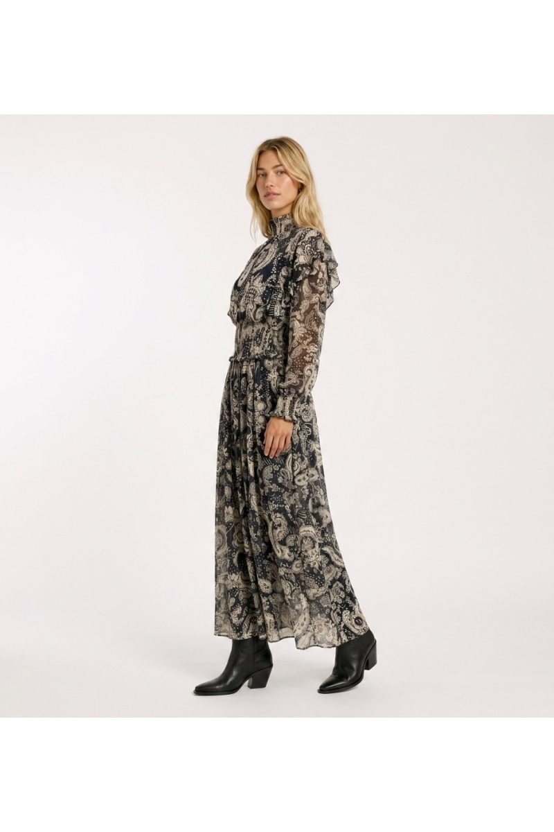 Elegant black and beige paisley midi dress, long sheer sleeves, ruffled high neck, shirred waist. Three-quarter view.