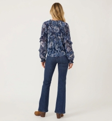 Back view of a sheer blue long-sleeve loose blouse with white/light blue floral pattern, ruffled shoulders/cuffs, drawstring.