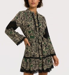 Green, black, beige paisley mini-dress. Long-sleeve, collared, tiered skirt, tie-waist, black lace trim. Three-quarter view.