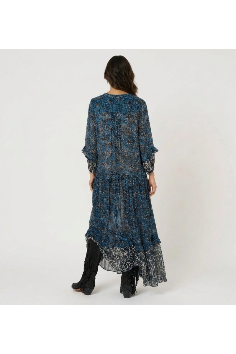 Back view: elegant long-sleeve tiered maxi dress. Blue, black & white floral print, sheer lightweight fabric, loose fit.