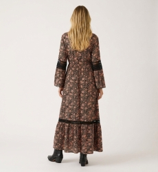 Back view of a long-sleeve black and peach paisley print maxi dress with collared neckline, smocked waist, and lace trim.
