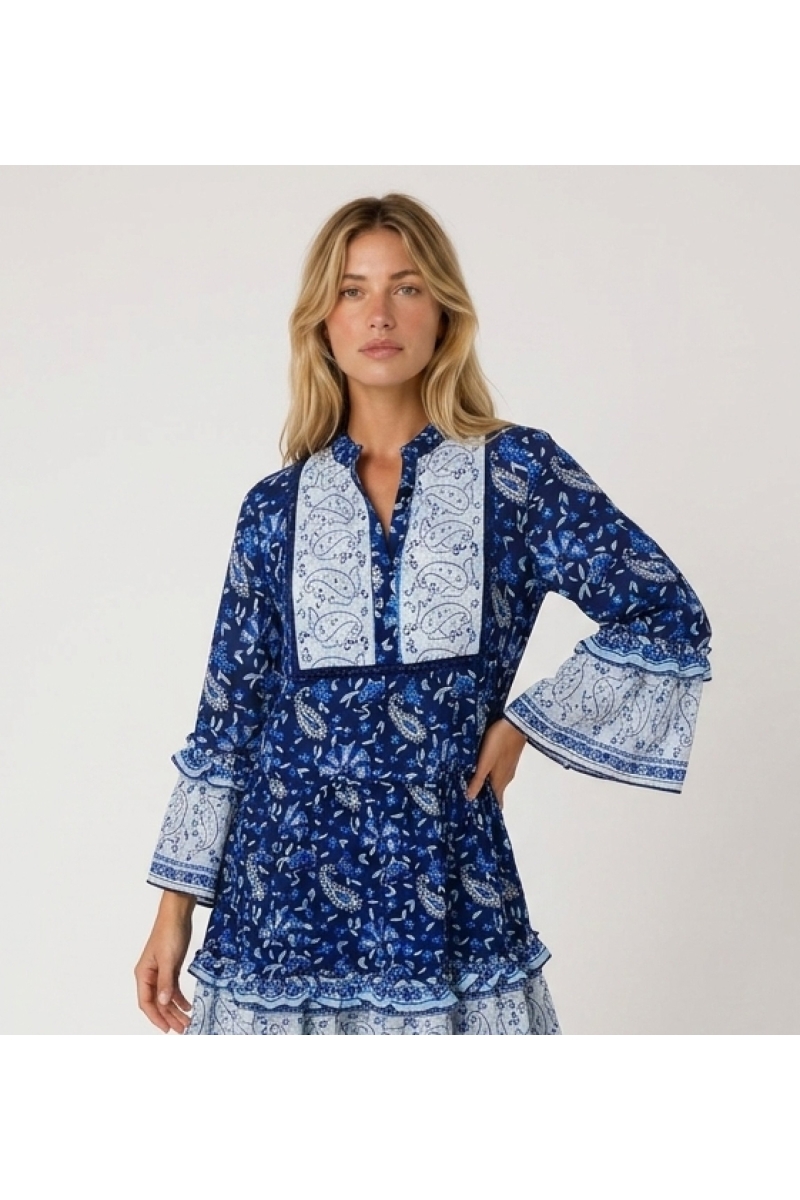 Blue and white paisley floral mini dress, collared V-neck, three-quarter ruffled sleeves, tiered skirt, side view.