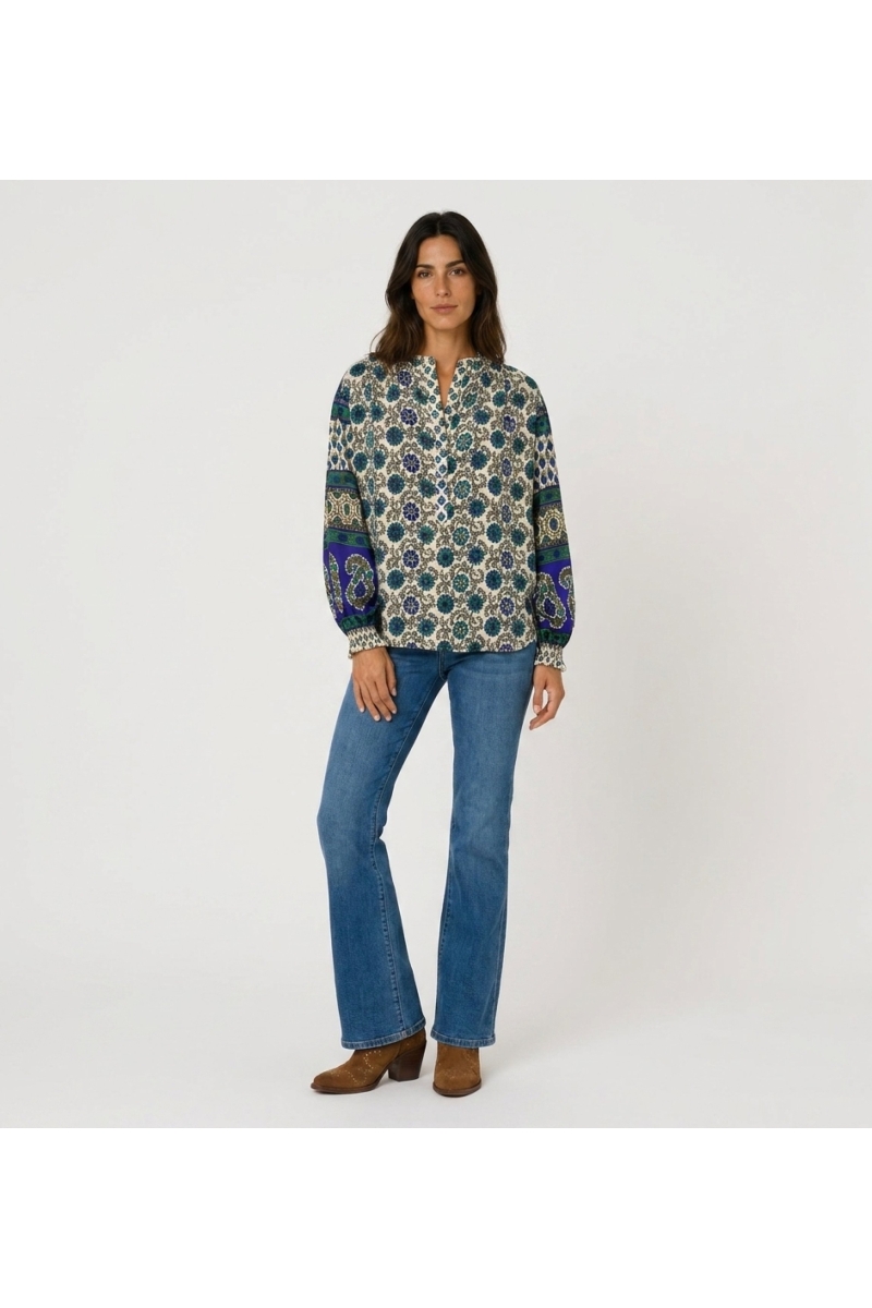 Front view: Cream long-sleeve blouse with blue & green floral print and contrasting patterned balloon sleeves, lightweight fabri