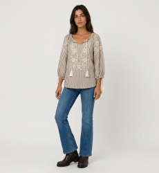 Front view of a brown and white striped peasant blouse with v-neck, 3/4 balloon sleeves, white floral embroidery, and tassels.