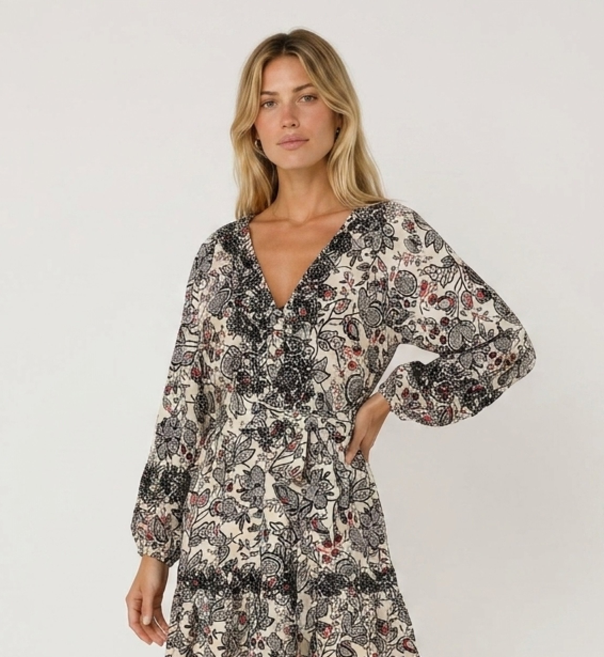 Cream mini-dress with black and red paisley pattern, V-neck, long sleeves, tiered skirt, tie-waist, lightweight fabric, three-qu