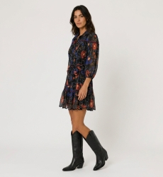 Three-quarter view of a black floral mini-dress with red and blue pattern, collared, balloon sleeves, tie-waist, tiered scallope