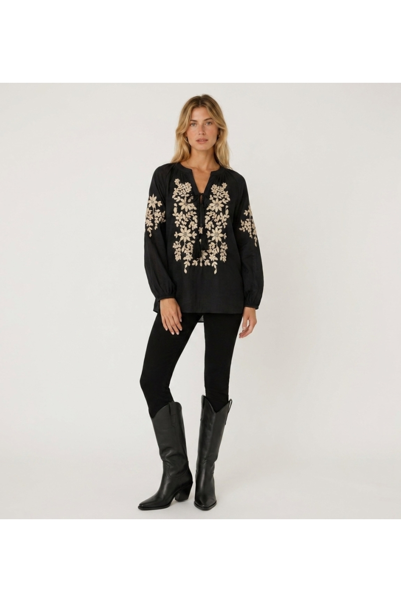 Black long-sleeve peasant blouse with V-neck, tie closure, and cream floral embroidery on front, linen-look fabric.