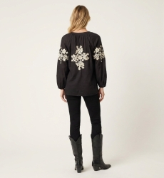 Black long-sleeve linen-blend peasant blouse with cream floral embroidery, detailed back view.