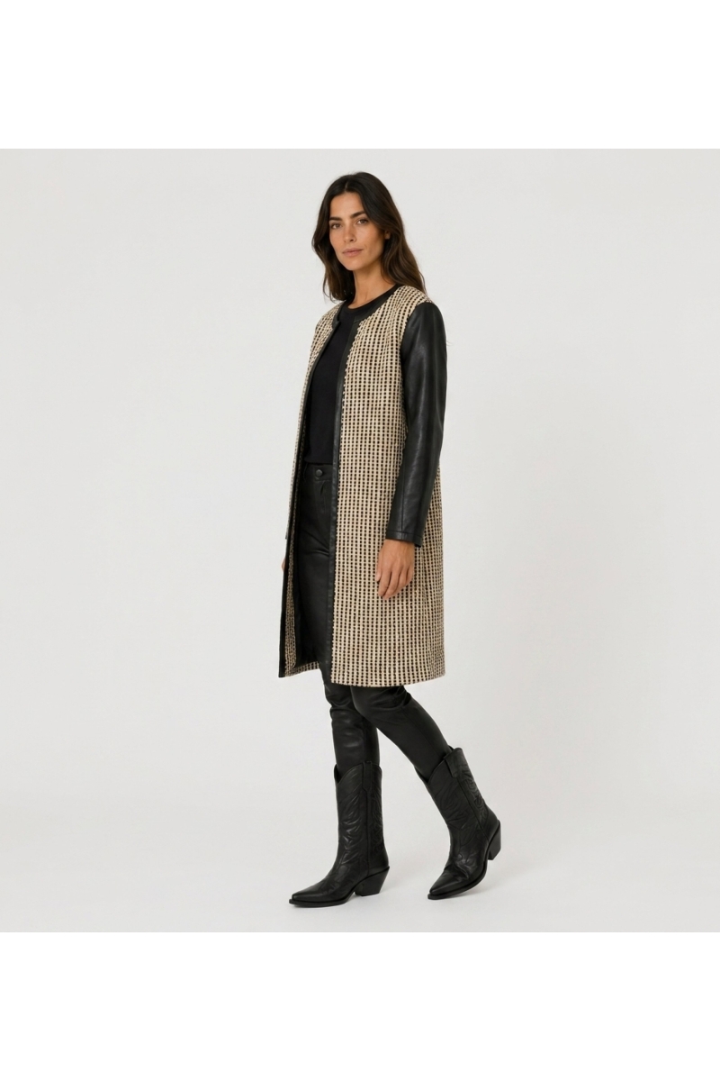 Collarless long jacket, black and beige woven fabric, open-front, with black faux leather sleeves and trim, three-quarter view.