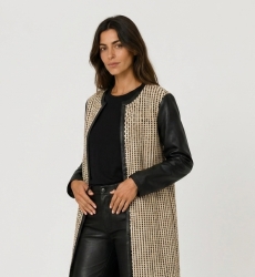 Chic collarless long jacket: black and beige woven fabric, faux leather sleeves and trim, open front.